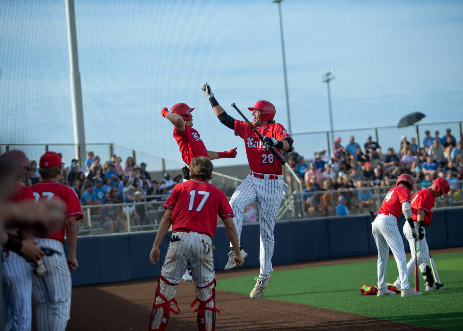 Cole Kaase celebrates after scoring a run during Saturday's Regional Quarterfinal between Katy and Tompkins at Cy-Springs.